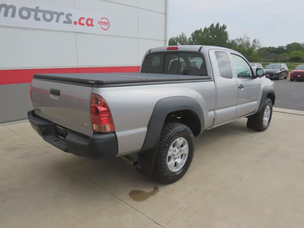 2015 Toyota Tacoma Base V6 | 4WD | Automatic | Access Cab | Low Kms | Touchscreen Display | Bluetooth | Air Conditioning | Cruise Control | Power Windows | Power Mirrors | Sliding Rear Window  | Steering Wheel Audio Controls Photo