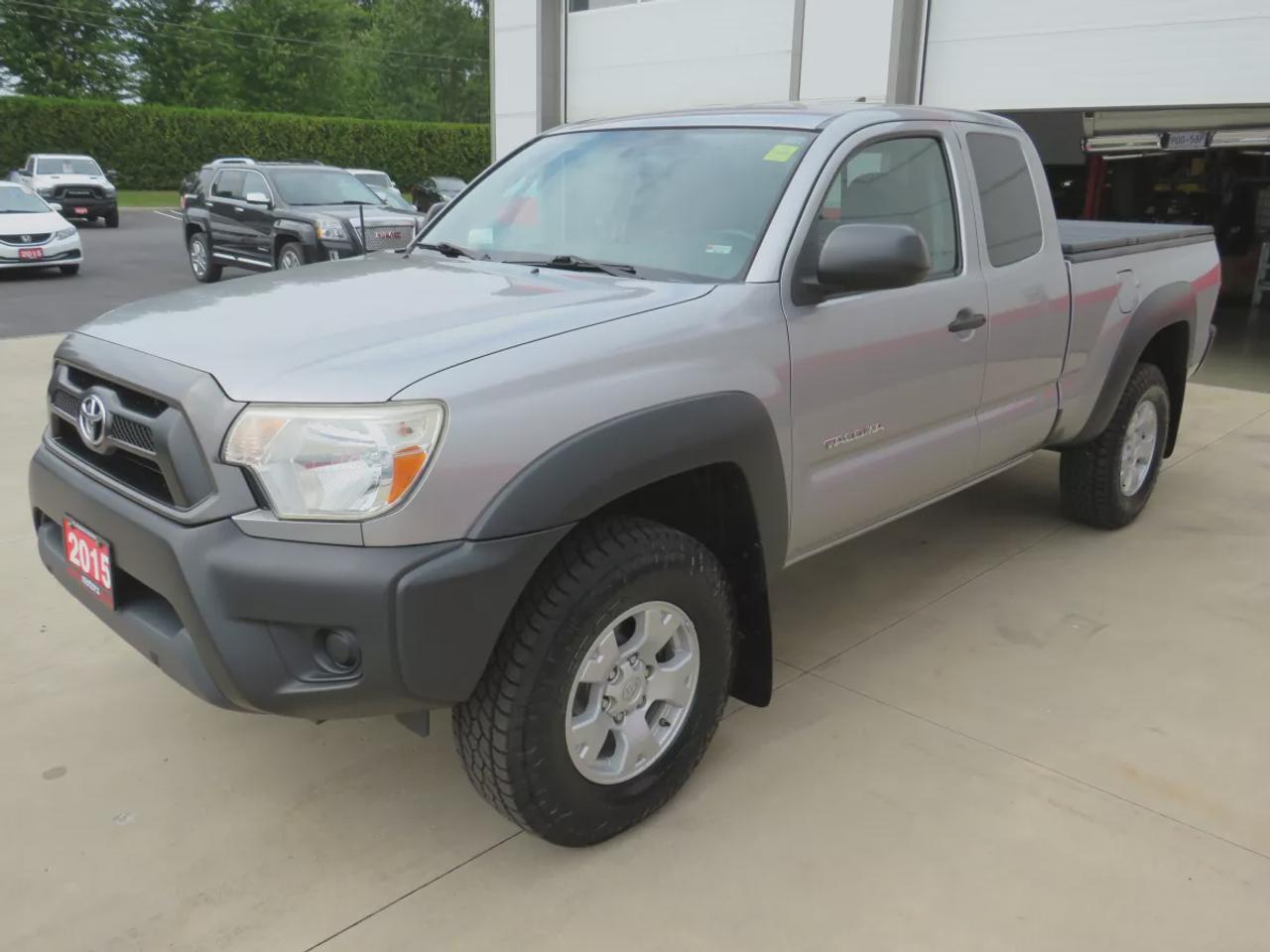 2015 Toyota Tacoma Base V6 | 4WD | Automatic | Access Cab | Low Kms | Touchscreen Display | Bluetooth | Air Conditioning | Cruise Control | Power Windows | Power Mirrors | Sliding Rear Window  | Steering Wheel Audio Controls Photo