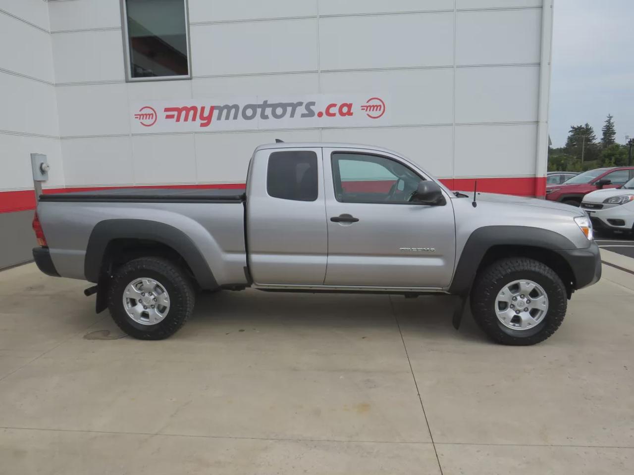 2015 Toyota Tacoma Base V6 | 4WD | Automatic | Access Cab | Low Kms | Touchscreen Display | Bluetooth | Air Conditioning | Cruise Control | Power Windows | Power Mirrors | Sliding Rear Window  | Steering Wheel Audio Controls Photo