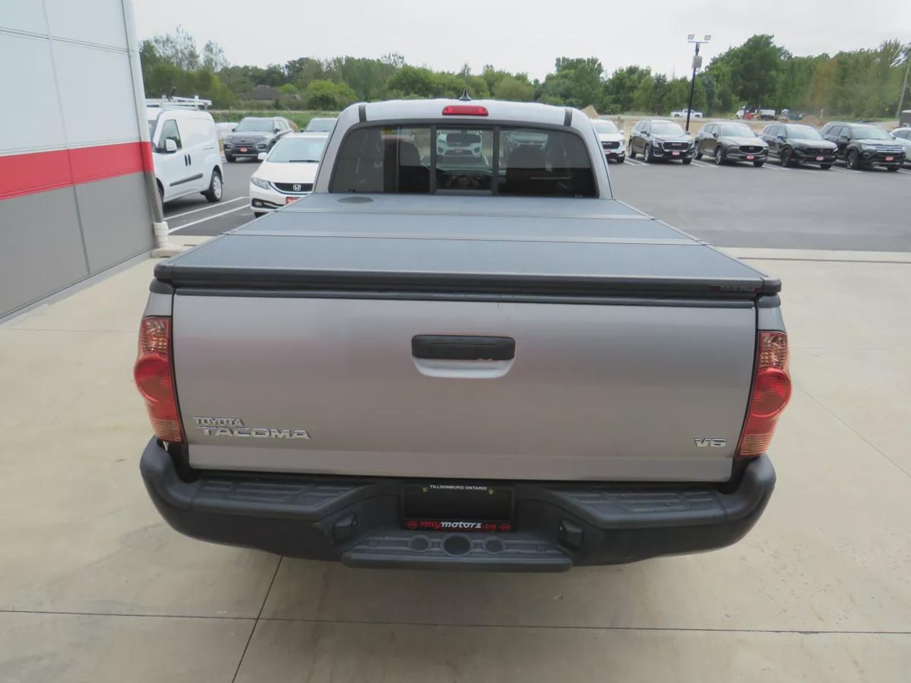 2015 Toyota Tacoma Base V6 | 4WD | Automatic | Access Cab | Low Kms | Touchscreen Display | Bluetooth | Air Conditioning | Cruise Control | Power Windows | Power Mirrors | Sliding Rear Window  | Steering Wheel Audio Controls Photo