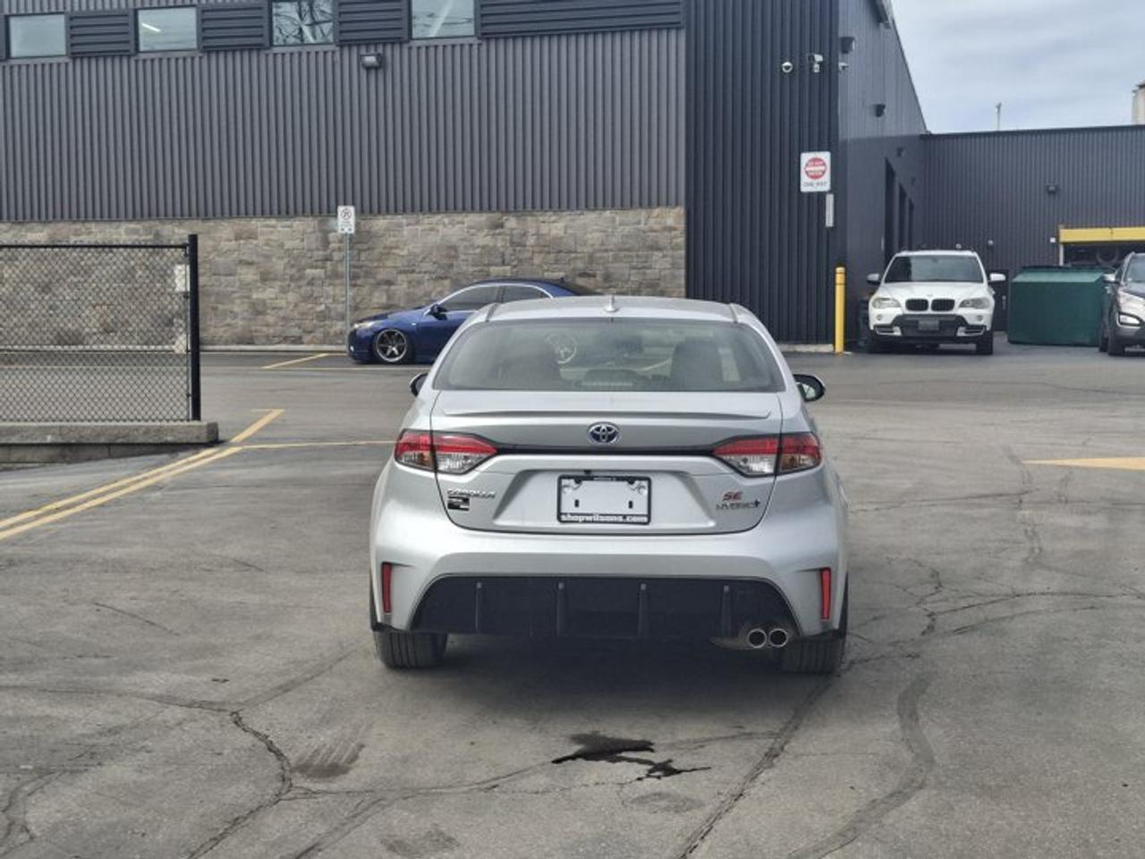 2023 Toyota Corolla Hybrid SE | Sunroof | Heated Seats + Steering | Adaptive Cruise | CarPlay | Rear Cam | and More ! Photo