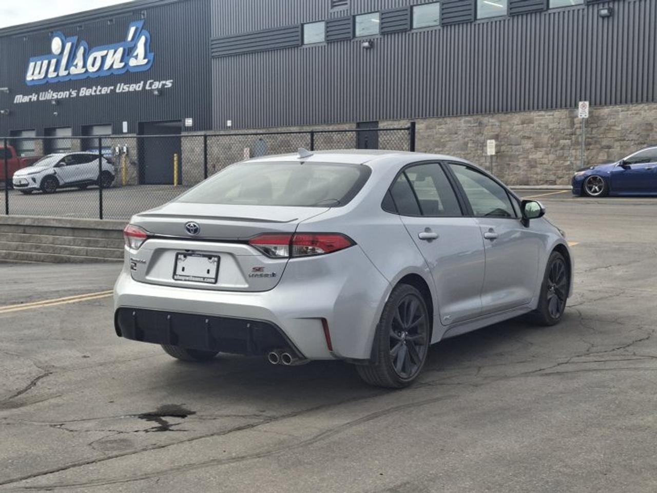 2023 Toyota Corolla Hybrid SE | Sunroof | Heated Seats + Steering | Adaptive Cruise | CarPlay | Rear Cam | and More ! Photo
