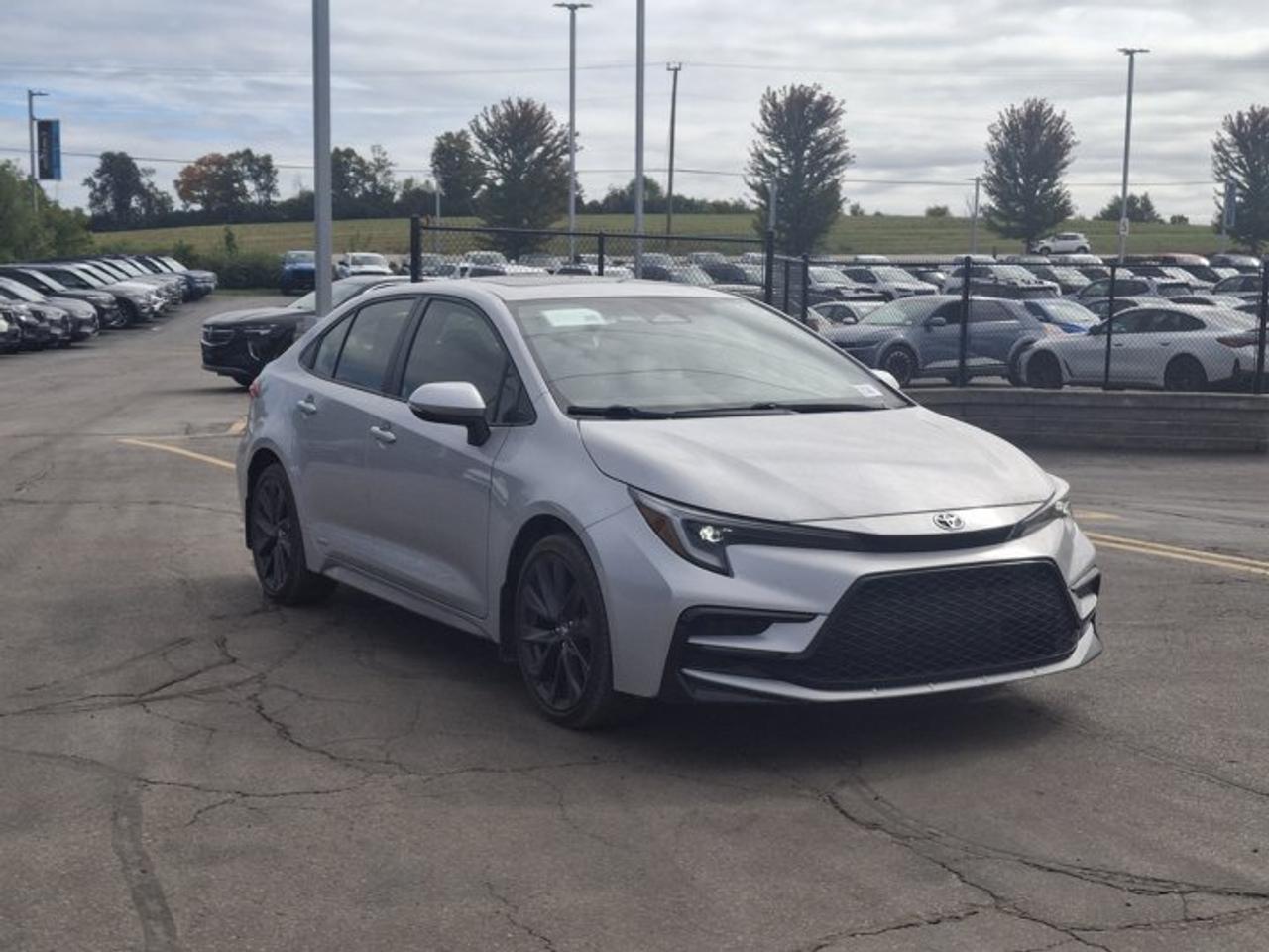 2023 Toyota Corolla Hybrid SE | Sunroof | Heated Seats + Steering | Adaptive Cruise | CarPlay | Rear Cam | and More ! Photo
