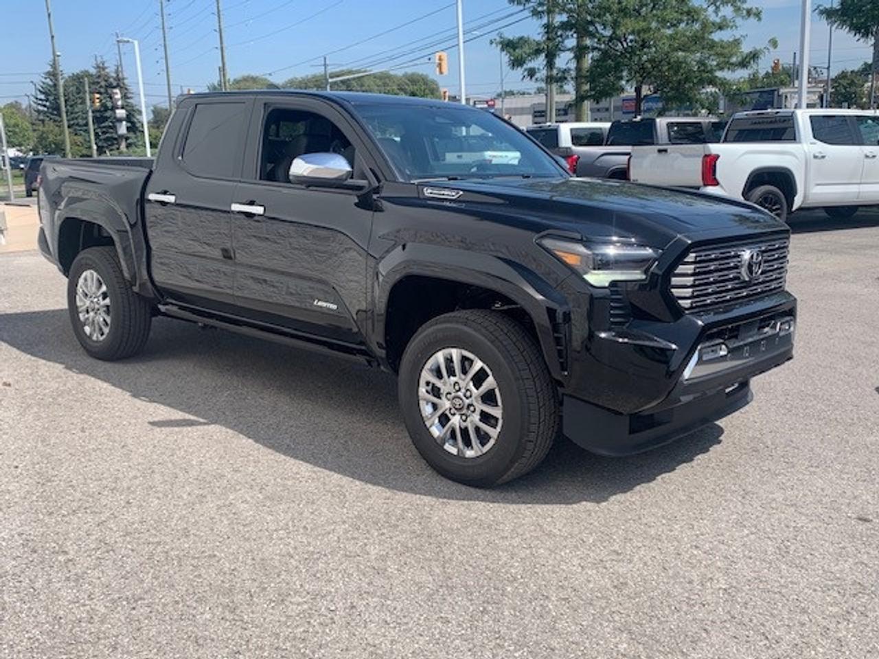 2026 Toyota TACOMA HYBRID power running boards and more! Photo