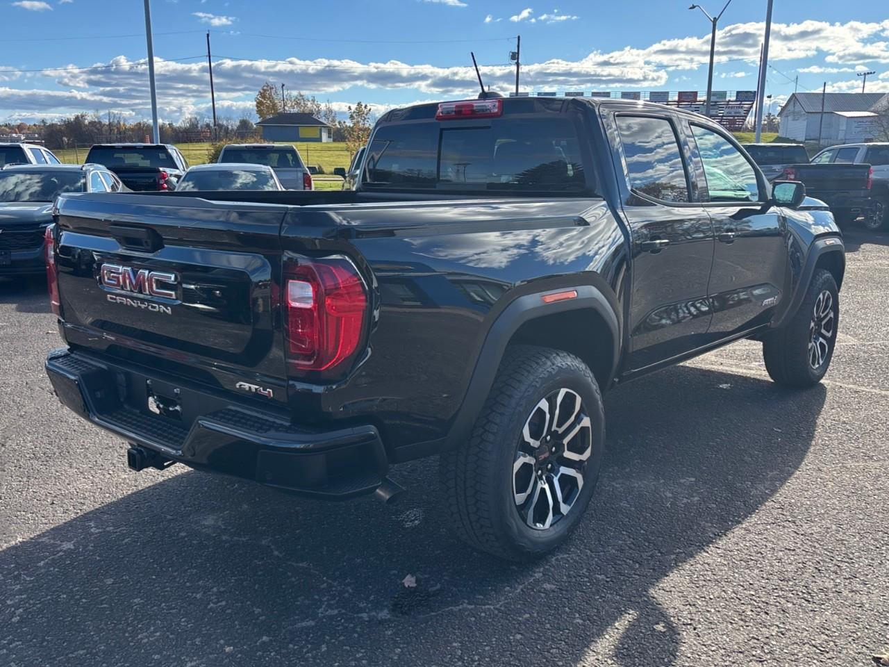 2026 GMC Canyon AT4 New 5 Passenger Mid Size 4X4 Crew Cab Truck with Heated and Ventilated Front Seats, Power Front Seats, Heated Steering Wheel, Adaptive Cruise Control, Power Sunroof and a 11 Diagonal Touchscreen Radio Photo