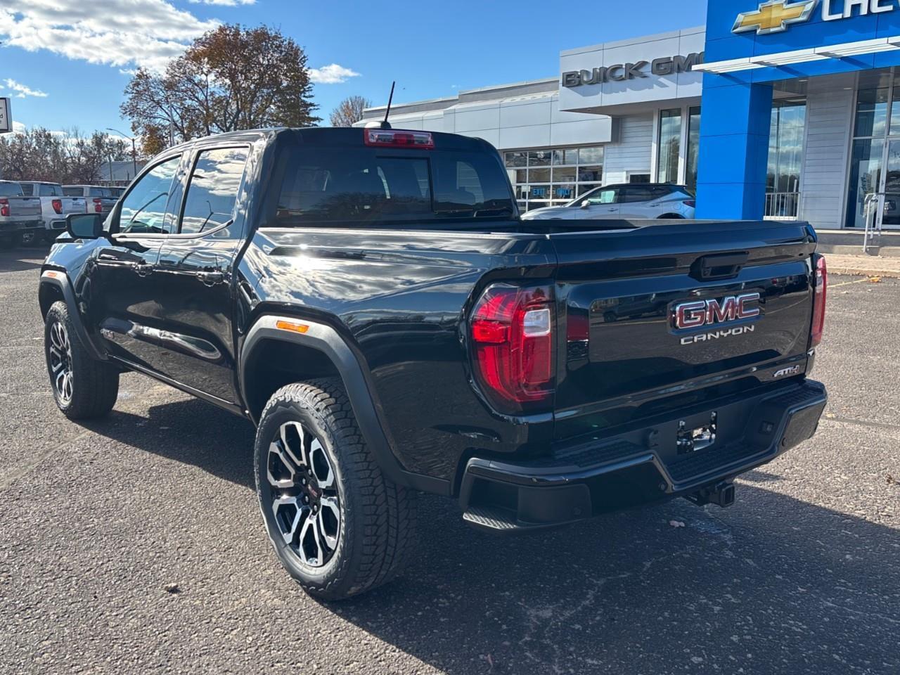 2026 GMC Canyon AT4 New 5 Passenger Mid Size 4X4 Crew Cab Truck with Heated and Ventilated Front Seats, Power Front Seats, Heated Steering Wheel, Adaptive Cruise Control, Power Sunroof and a 11 Diagonal Touchscreen Radio Photo