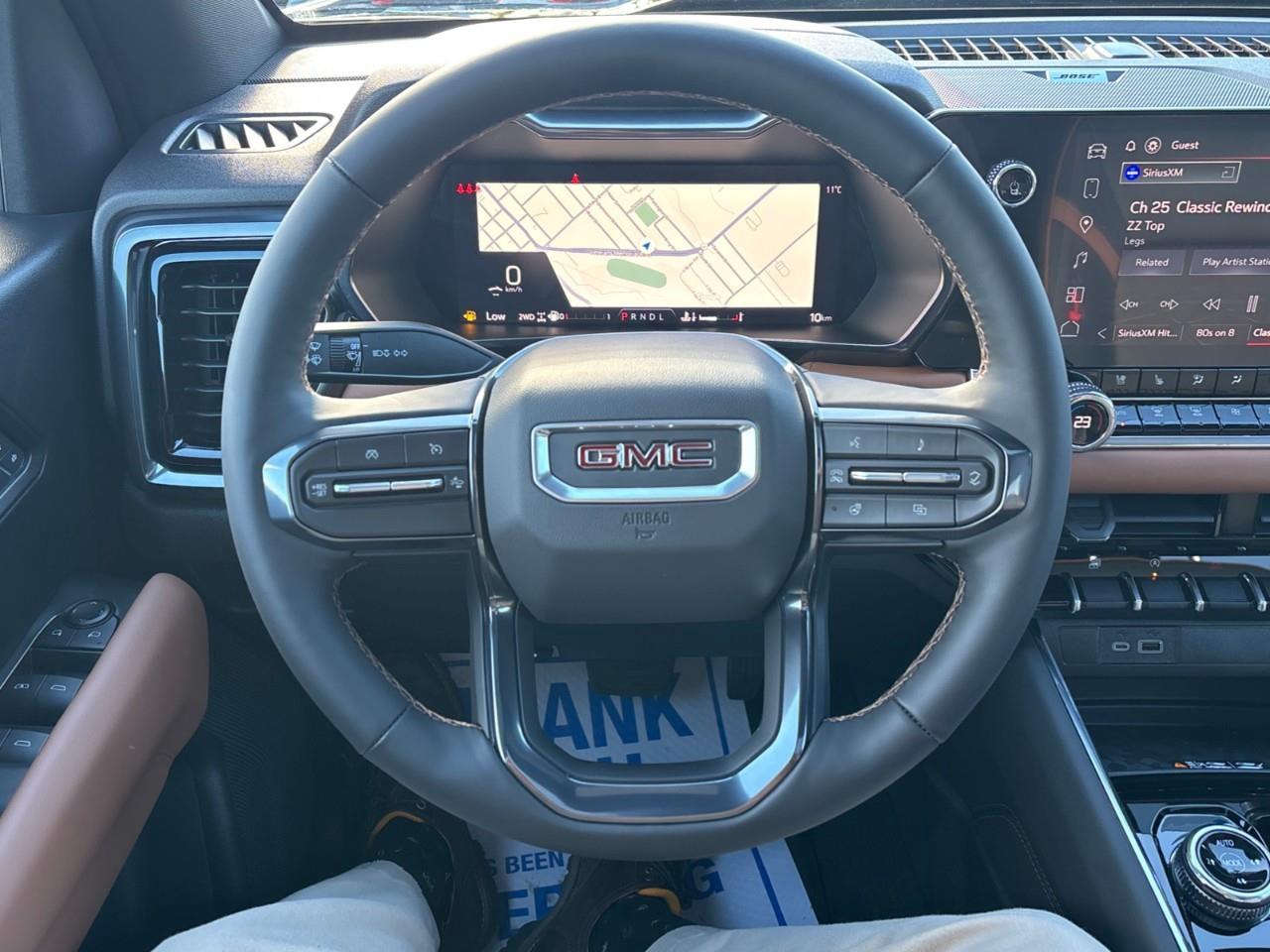 2026 GMC Canyon AT4 New 5 Passenger Mid Size 4X4 Crew Cab Truck with Heated and Ventilated Front Seats, Power Front Seats, Heated Steering Wheel, Adaptive Cruise Control, Power Sunroof and a 11 Diagonal Touchscreen Radio Photo
