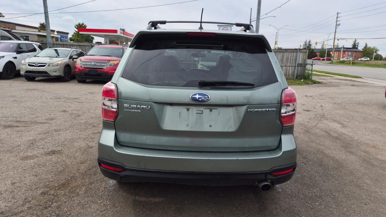 2015 Subaru Forester TOURING, TECH, MOONROOF, 2 SETS WHEELS, CERT Photo