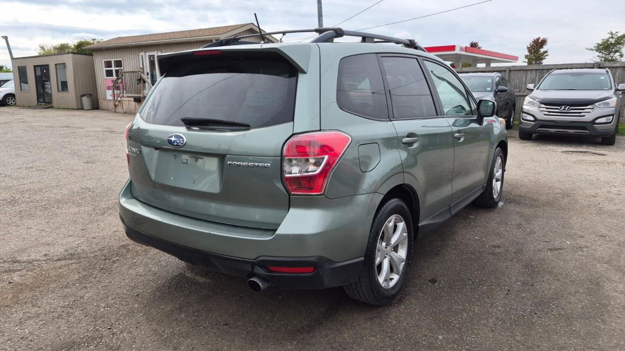 2015 Subaru Forester TOURING, TECH, MOONROOF, 2 SETS WHEELS, CERT Photo