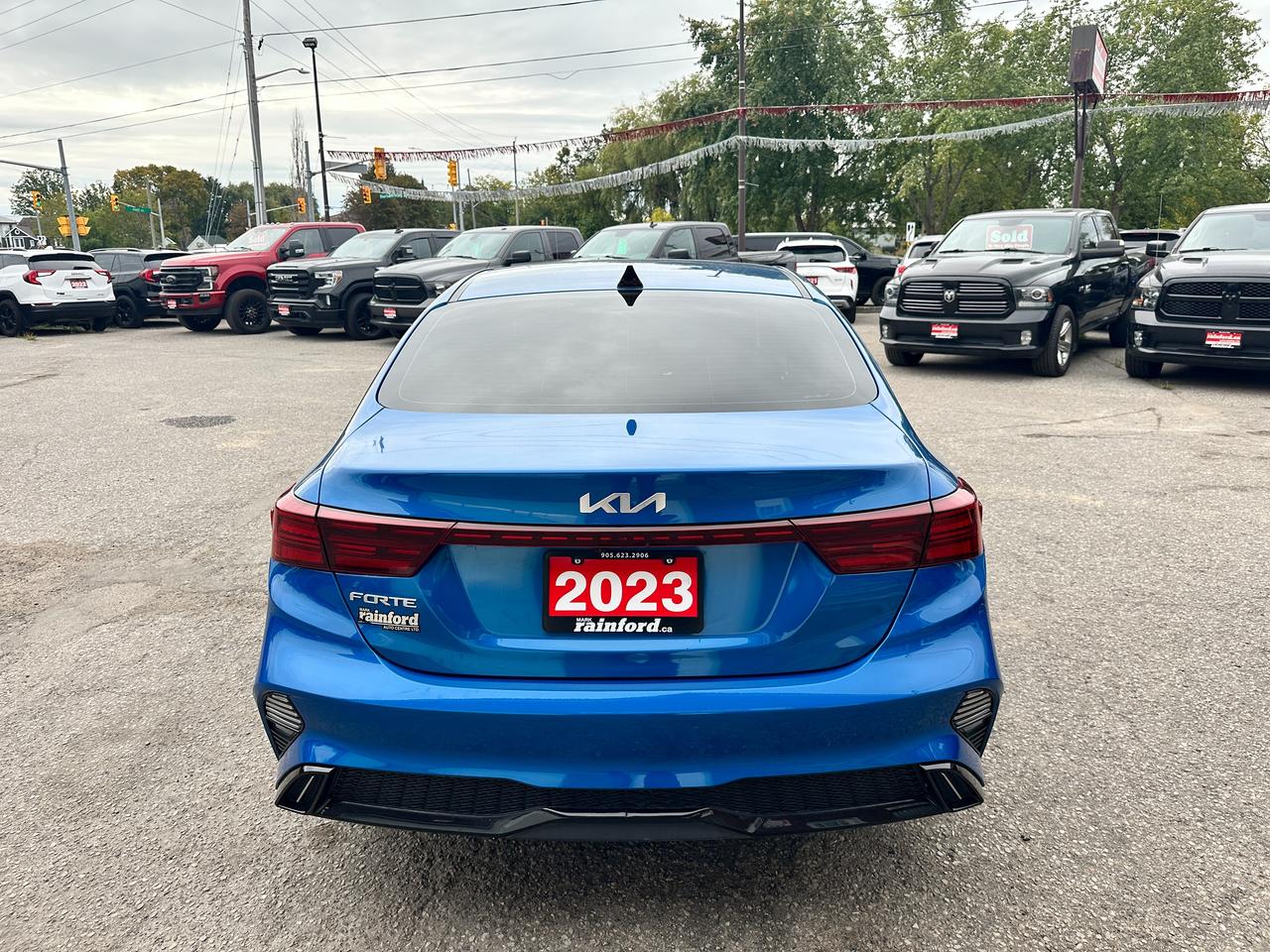 2023 Kia Forte EX HTD-Cloth A/C CarPlay HD-FM Backup Cam Alloys Photo