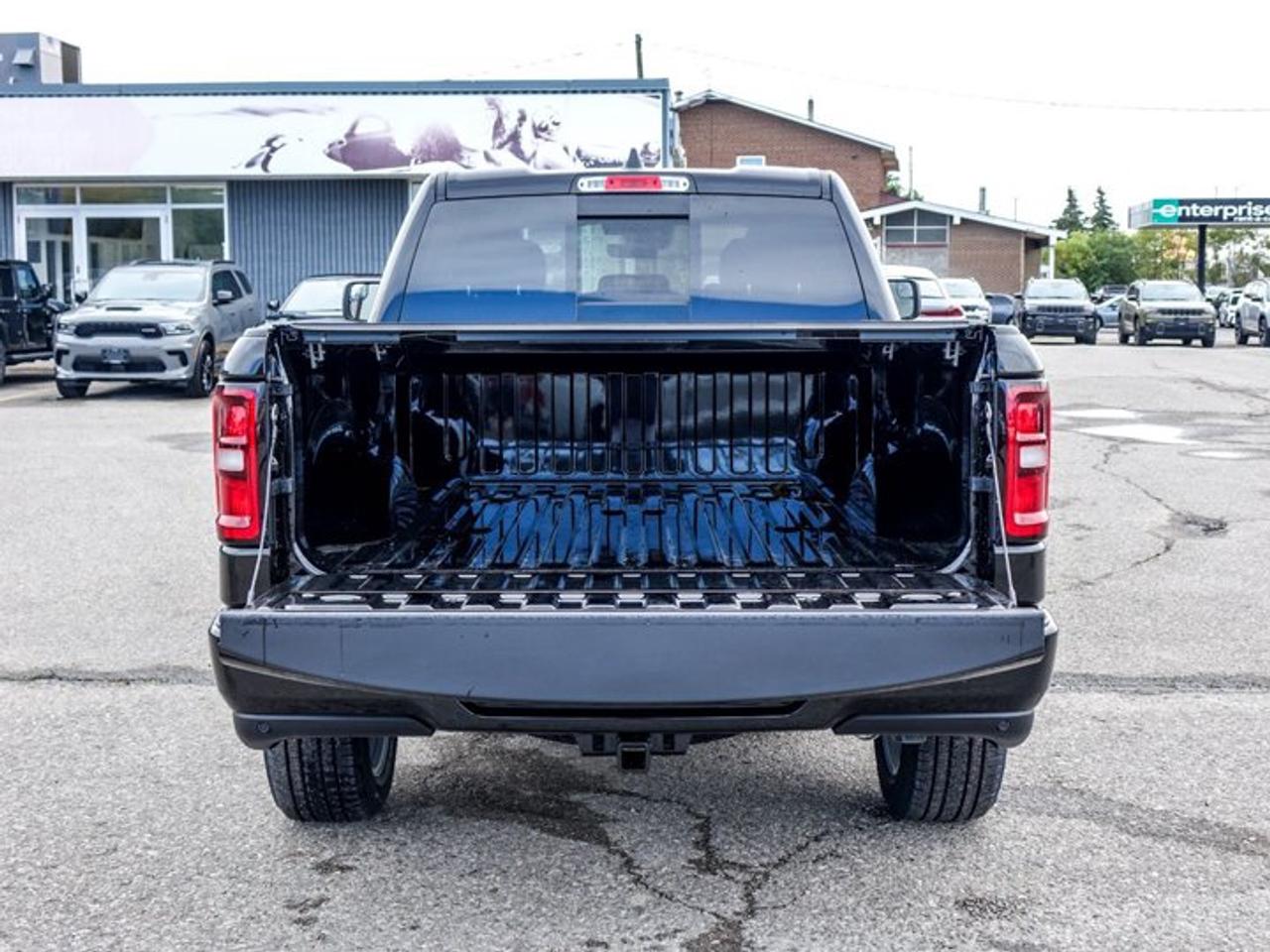2027 RAM 1500 Express Quad Cab 6'4" Box 3.6L Pentastar V6 with eTorque | Customer Preferred Package 23D | 20" PolishedPainted Aluminum Wheel Photo