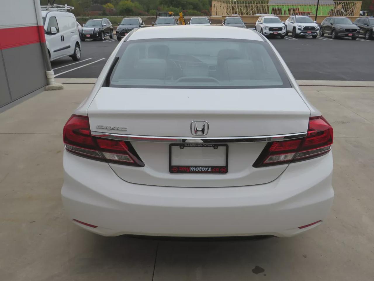 2015 Honda Civic Sedan LX | LOW KM!! | FWD | Automatic | Heated Seats | Air Conditioning | Bluetooth | Back-Up Camera | Cruise Control | Steering Wheel Audio Controls | USB Input | Keyless Entry | Power Windows | Power Door Locks | Heated Power Mirrors Photo