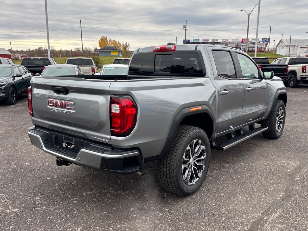 2026 GMC Canyon Denali New 5 Passenger Mid Size 4X4 Crew Cab Truck with Heated and Ventilated Front Seats, Power Front Seats, Heated Steering Wheel, Adaptive Cruise Control, Power Sunroof, Hard Folding Tonneau Cover and a 1 Photo