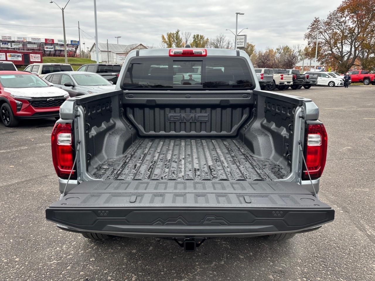 2026 GMC Canyon Denali New 5 Passenger Mid Size 4X4 Crew Cab Truck with Heated and Ventilated Front Seats, Power Front Seats, Heated Steering Wheel, Adaptive Cruise Control, Power Sunroof, Hard Folding Tonneau Cover and a 1 Photo