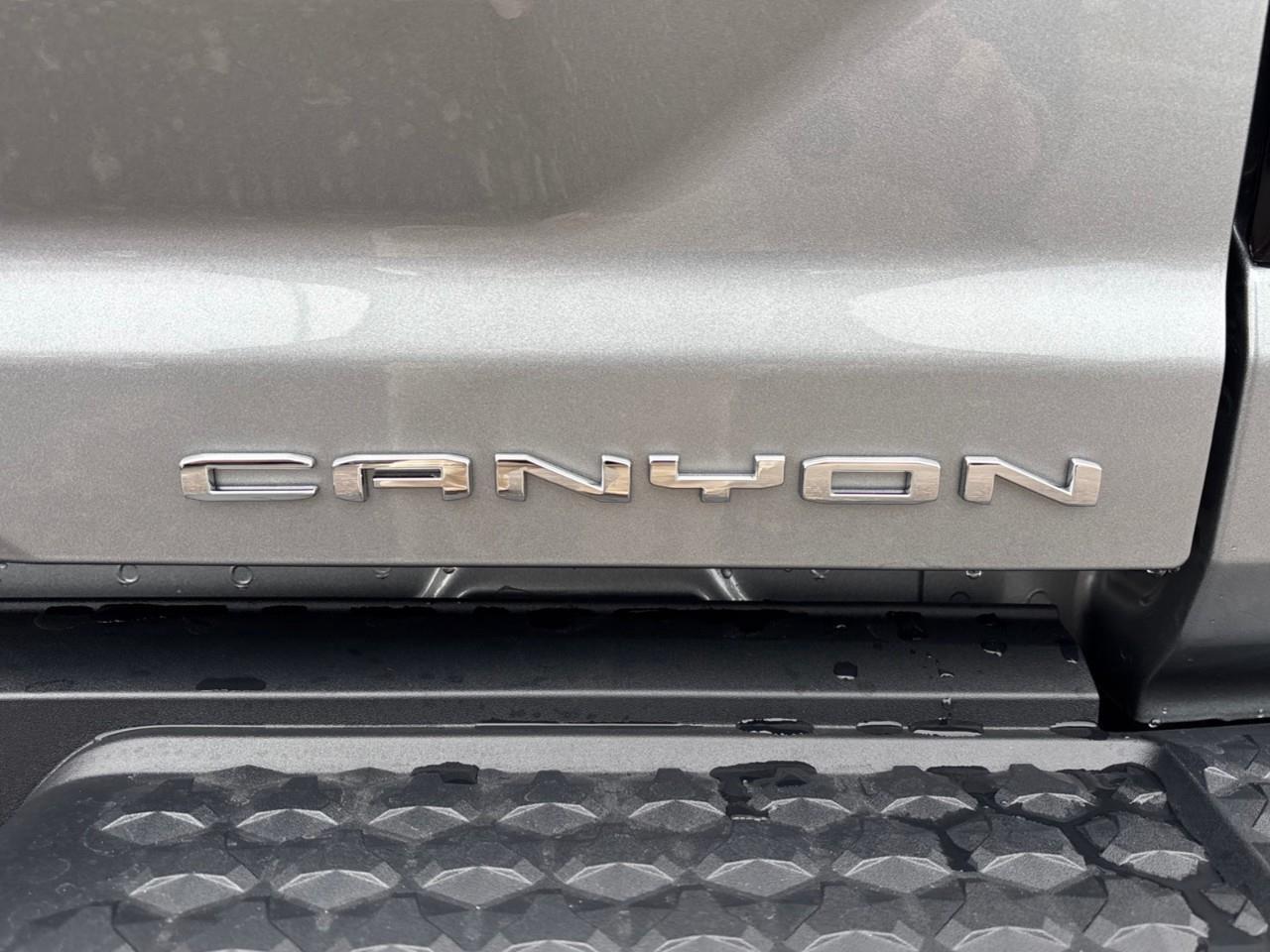 2026 GMC Canyon Denali New 5 Passenger Mid Size 4X4 Crew Cab Truck with Heated and Ventilated Front Seats, Power Front Seats, Heated Steering Wheel, Adaptive Cruise Control, Power Sunroof, Hard Folding Tonneau Cover and a 1 Photo