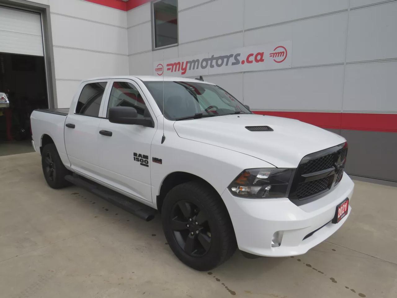 2021 RAM 1500 Classic Express | 4WD | Automatic | Crew Cab | Short Bed | Night Edition | Alloy Wheels | Heated Seats | Heated Steering Wheel | Power Driver Seat | Multi-Zone Climate Control | Android Auto & Apple CarPlay | Bluetooth | Back-Up Camera | Remote Start | Auto-Dimmi Photo0