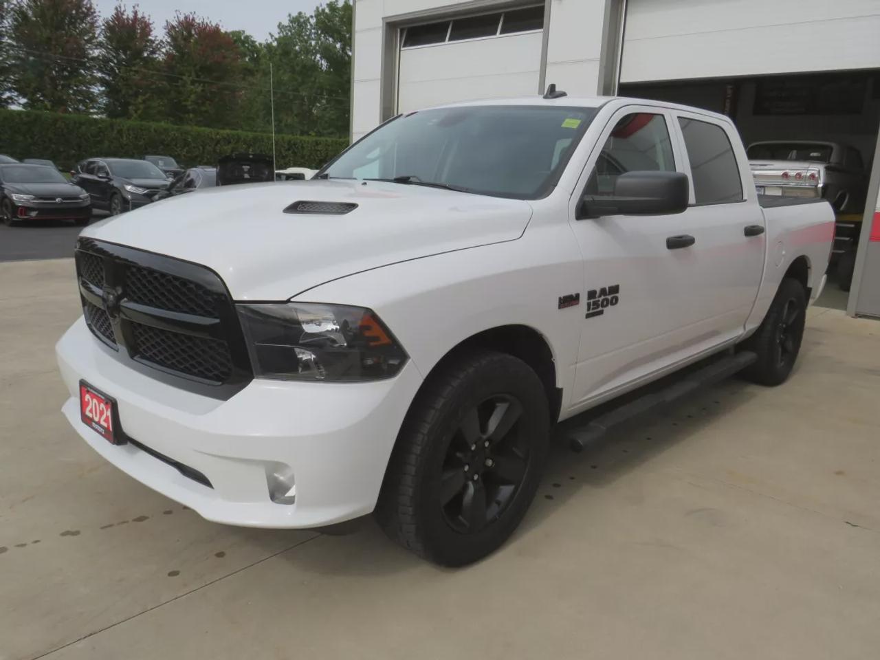 2021 RAM 1500 Classic Express | 4WD | Automatic | Crew Cab | Short Bed | Night Edition | Alloy Wheels | Heated Seats | Heated Steering Wheel | Power Driver Seat | Multi-Zone Climate Control | Android Auto & Apple CarPlay | Bluetooth | Back-Up Camera | Remote Start | Auto-Dimmi Photo