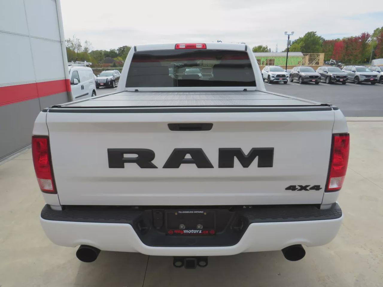 2021 RAM 1500 Classic Express | 4WD | Automatic | Crew Cab | Short Bed | Night Edition | Alloy Wheels | Heated Seats | Heated Steering Wheel | Power Driver Seat | Multi-Zone Climate Control | Android Auto & Apple CarPlay | Bluetooth | Back-Up Camera | Remote Start | Auto-Dimmi Photo