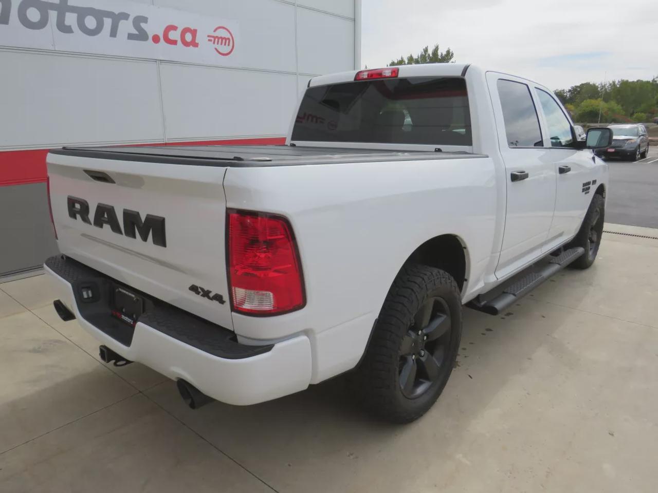 2021 RAM 1500 Classic Express | 4WD | Automatic | Crew Cab | Short Bed | Night Edition | Alloy Wheels | Heated Seats | Heated Steering Wheel | Power Driver Seat | Multi-Zone Climate Control | Android Auto & Apple CarPlay | Bluetooth | Back-Up Camera | Remote Start | Auto-Dimmi Photo