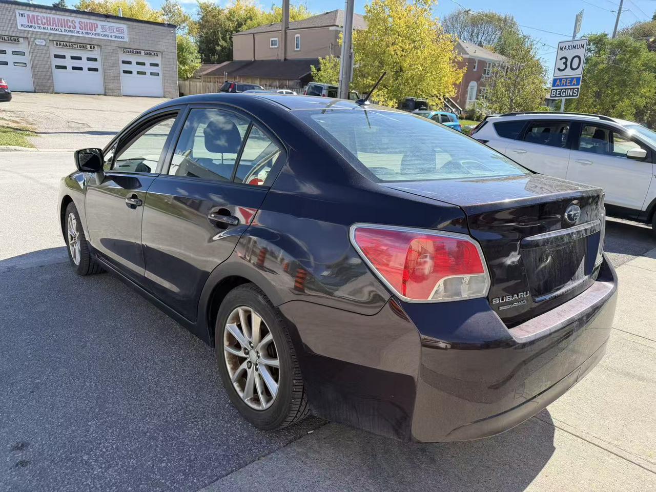 2013 Subaru Impreza 4dr Sdn CVT 2.0i w/Touring Pkg Photo