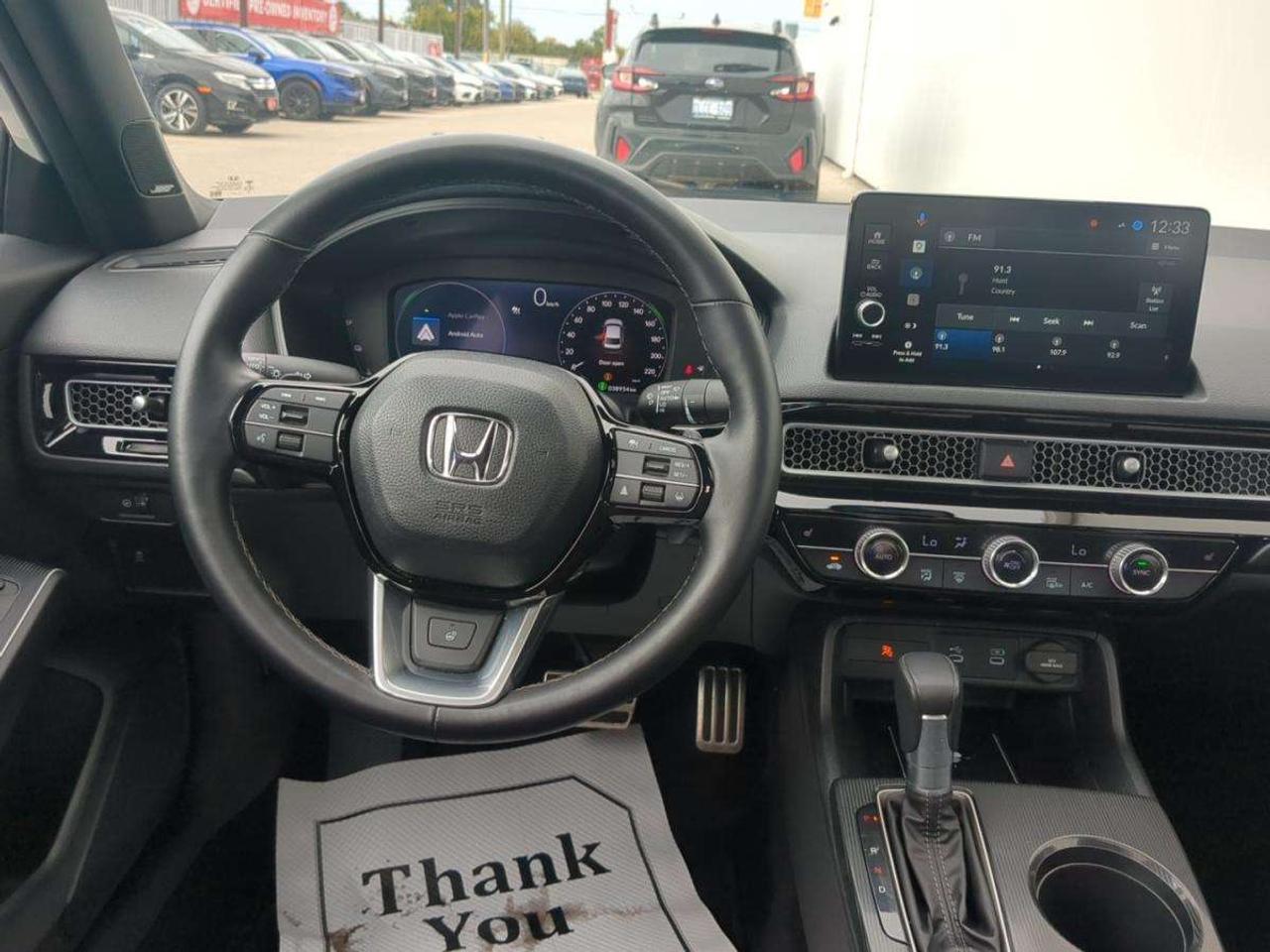 2025 Honda Civic Sport Touring eCVT Sedan 7 year/160,000km warranty Photo
