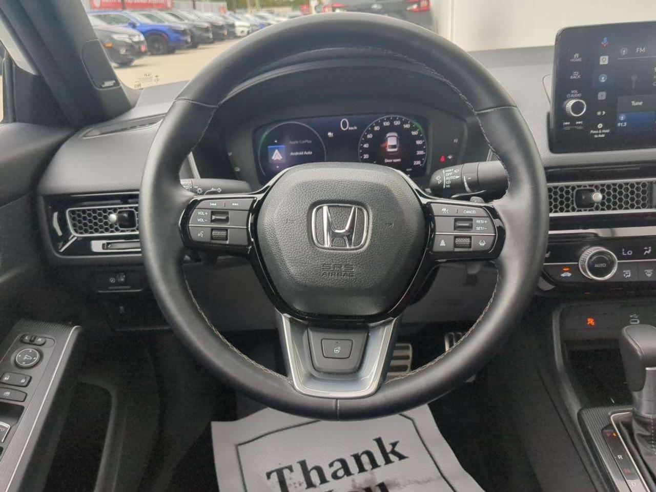 2025 Honda Civic Sport Touring eCVT Sedan 7 year/160,000km warranty Photo
