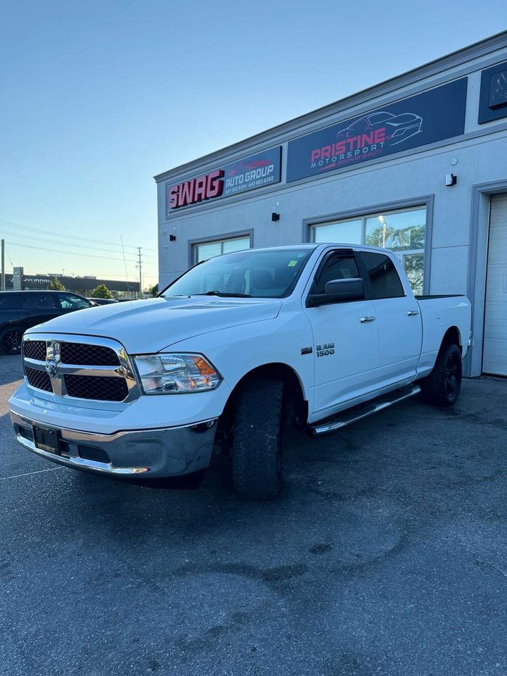 2016 RAM 1500 4WD Crew Cab 6'4 149 SLT Photo