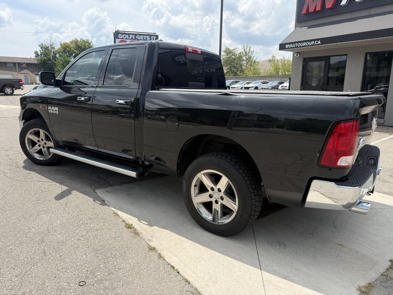 2016 RAM 1500 4WD Quad Cab 6.4 Ft Box Big Horn Photo