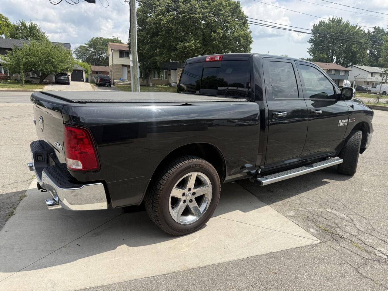 2016 RAM 1500 4WD Quad Cab 6.4 Ft Box Big Horn Photo