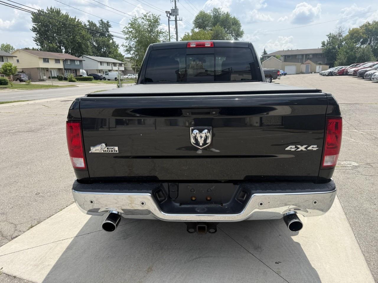 2016 RAM 1500 4WD Quad Cab 6.4 Ft Box Big Horn Photo