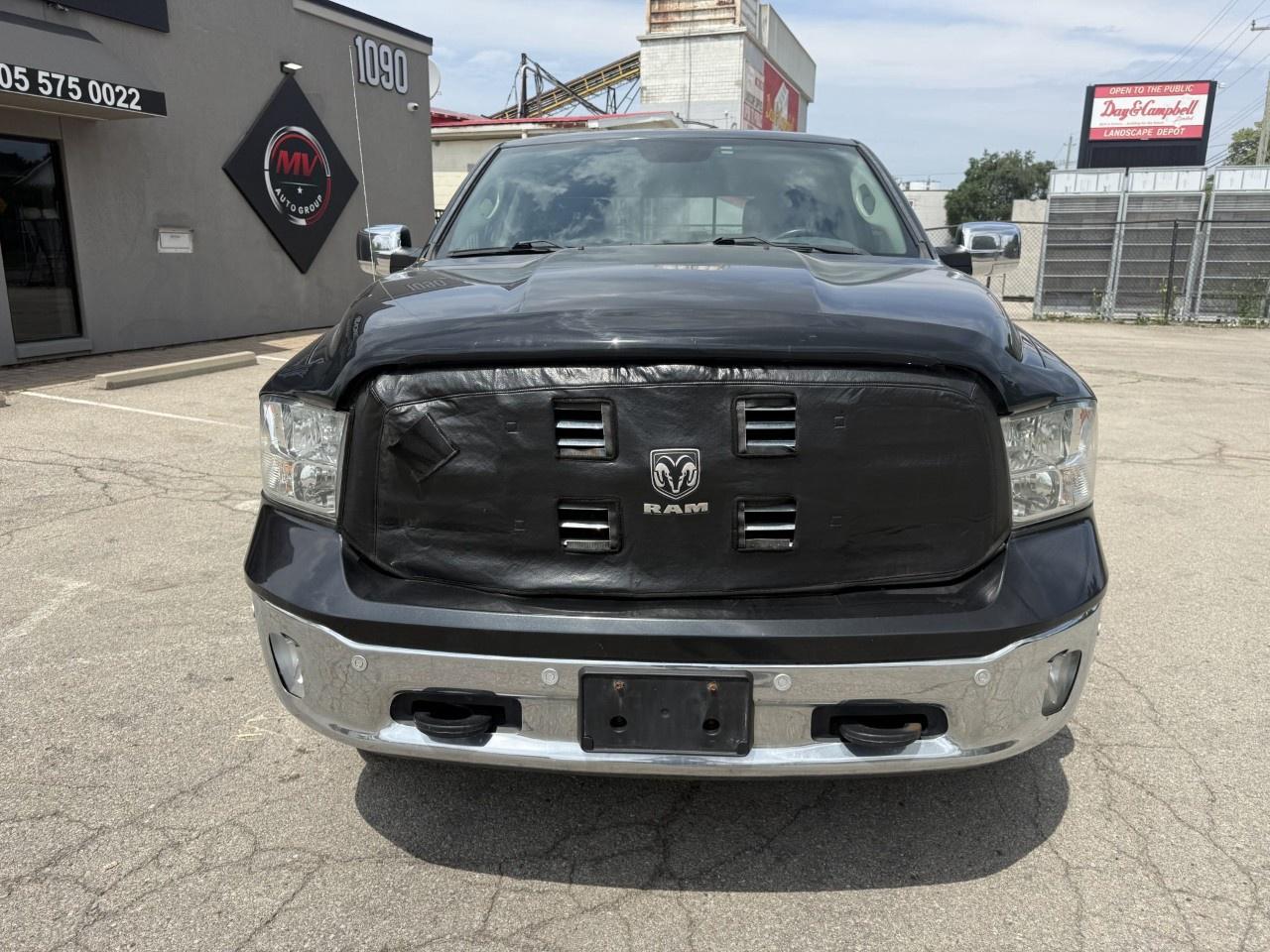 2016 RAM 1500 4WD Quad Cab 6.4 Ft Box Big Horn Photo