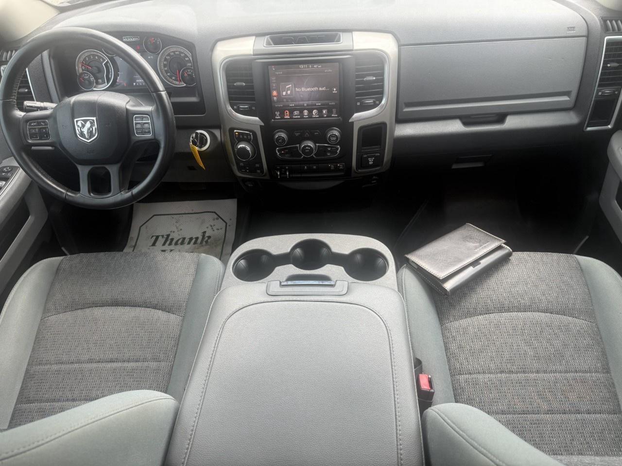 2016 RAM 1500 4WD Quad Cab 6.4 Ft Box Big Horn Photo