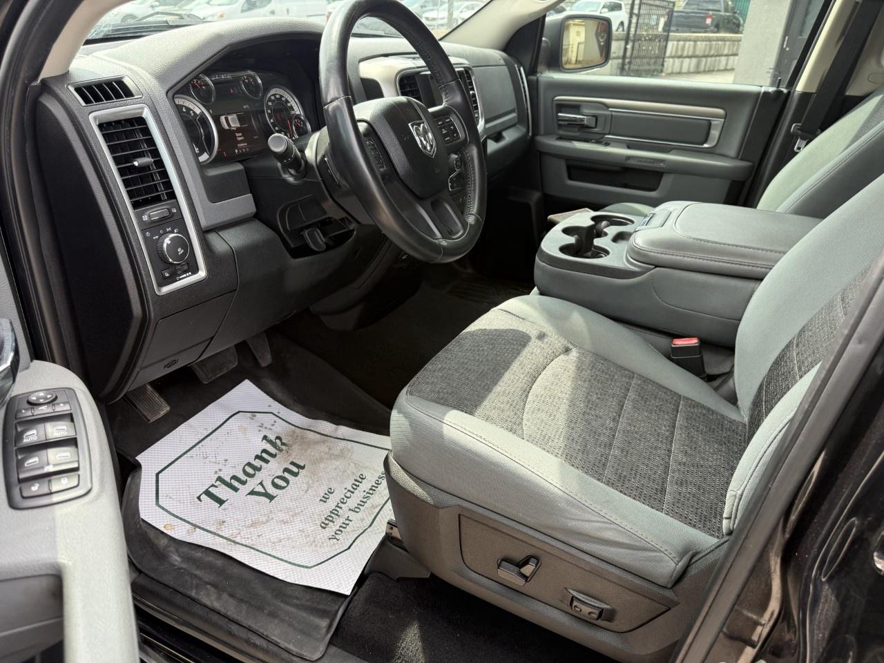 2016 RAM 1500 4WD Quad Cab 6.4 Ft Box Big Horn Photo