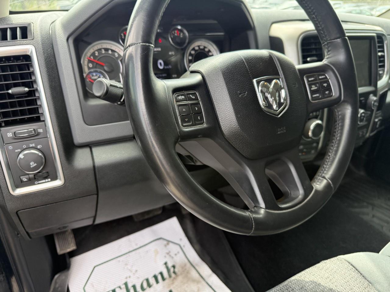2016 RAM 1500 4WD Quad Cab 6.4 Ft Box Big Horn Photo