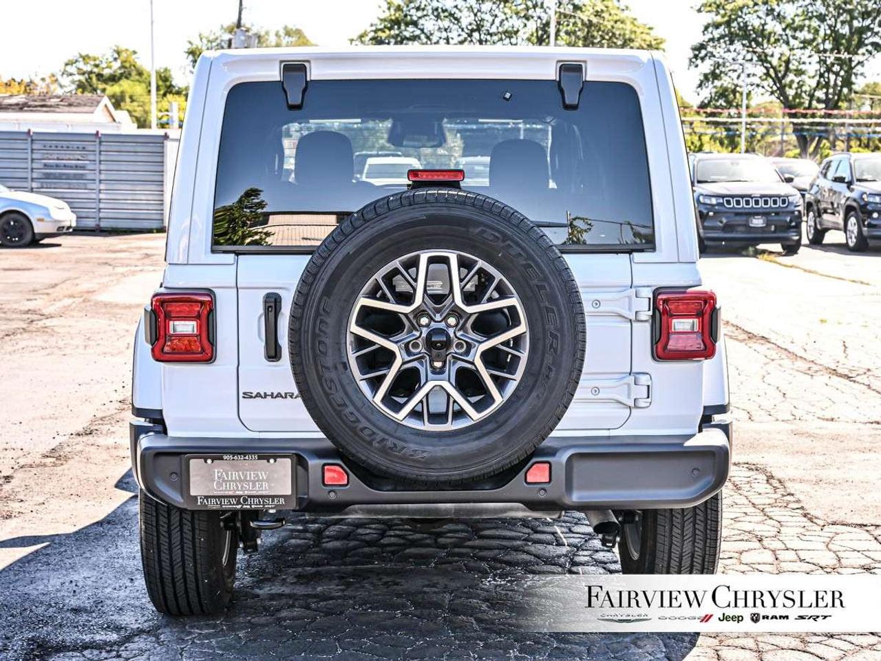 2026 Jeep Wrangler Sahara 4 Door 4x4 SKY TOP   BLIND SPOT   COMPANY CAR   CARPLAY   PARK ASSIST   CARPLAY   HEATED SEATS   HEATED STEERING W Photo