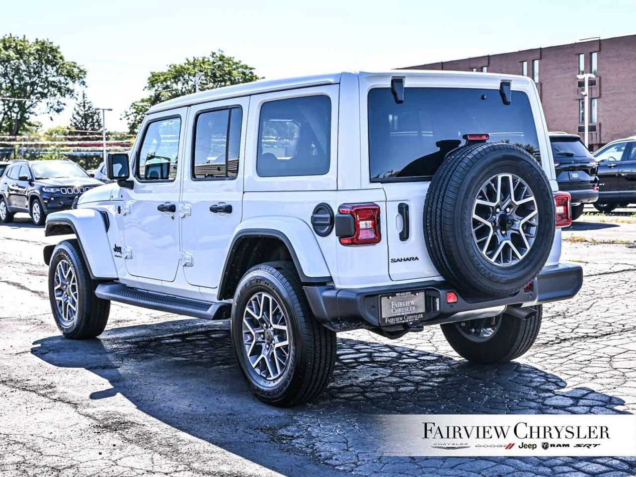 2026 Jeep Wrangler Sahara 4 Door 4x4 SKY TOP   BLIND SPOT   COMPANY CAR   CARPLAY   PARK ASSIST   CARPLAY   HEATED SEATS   HEATED STEERING W Photo