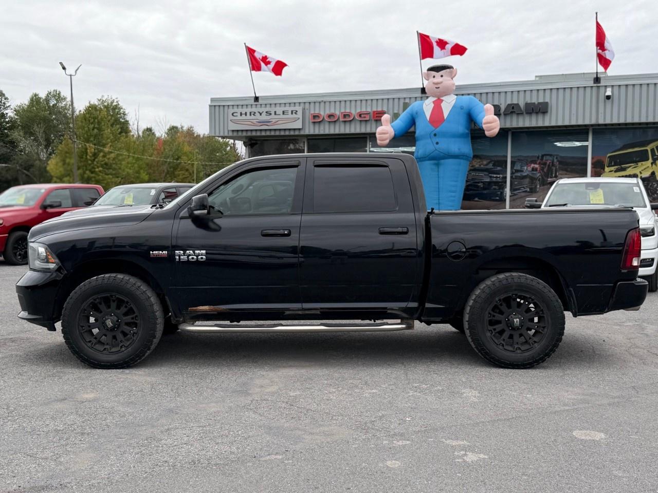 2014 RAM 1500 4WD Crew Cab 5.7 Ft Box Sport Photo1