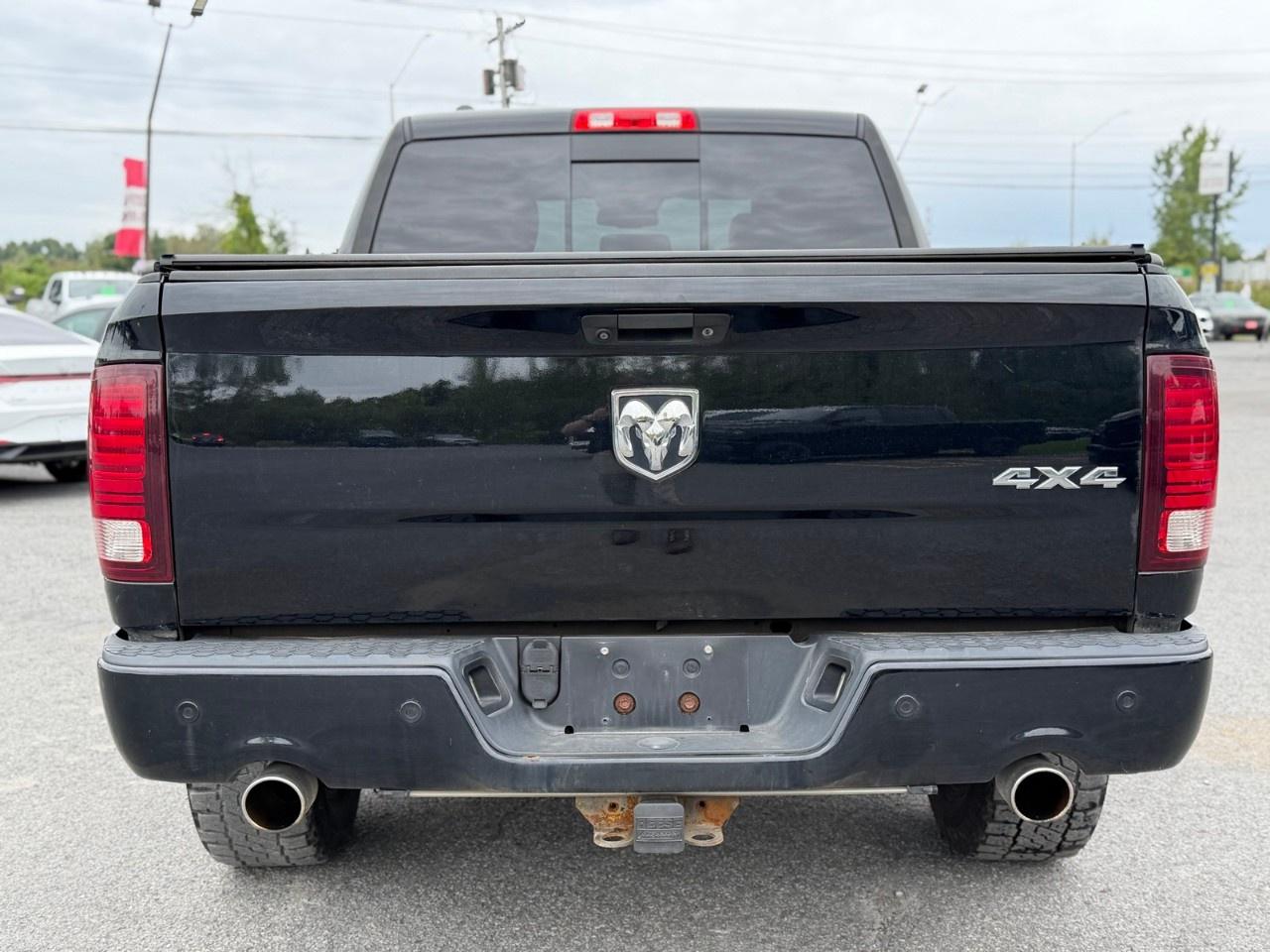2014 RAM 1500 4WD Crew Cab 5.7 Ft Box Sport Photo