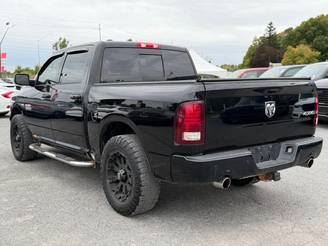 2014 RAM 1500 4WD Crew Cab 5.7 Ft Box Sport Photo