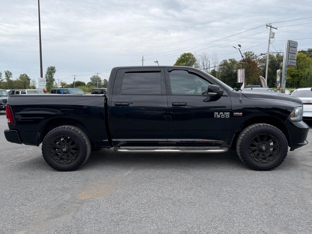 2014 RAM 1500 4WD Crew Cab 5.7 Ft Box Sport Photo