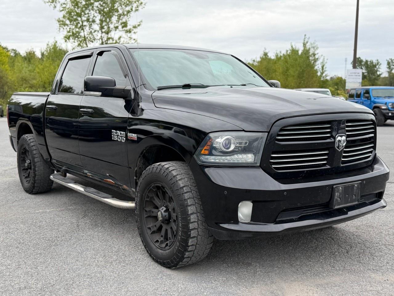 2014 RAM 1500 4WD Crew Cab 5.7 Ft Box Sport Photo