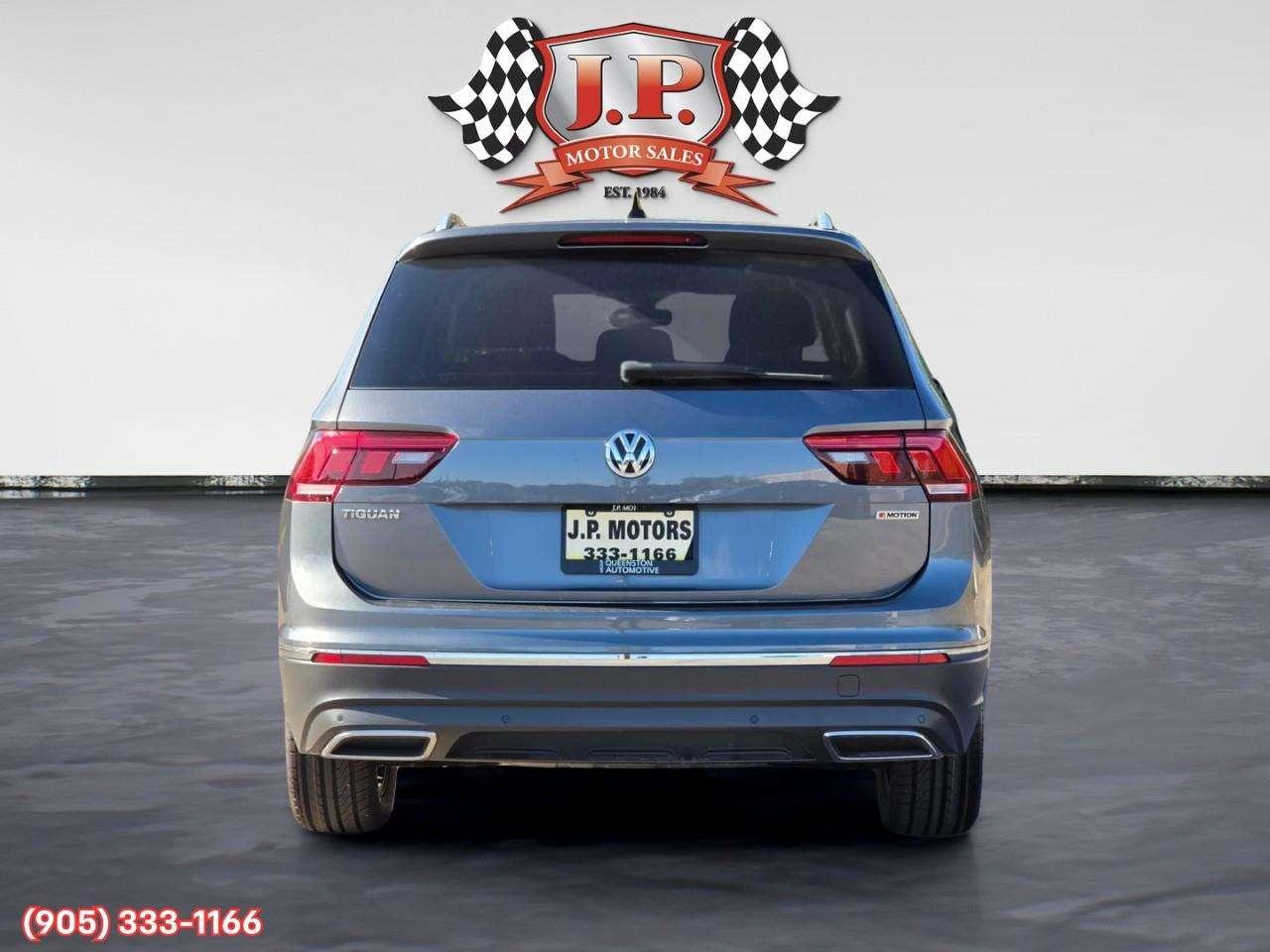 2021 Volkswagen Tiguan Highline Apple CarPlay & Android Auto • Power Sunroof • Leather Seating • Built-In Navigation System • Remote Start Syste Photo