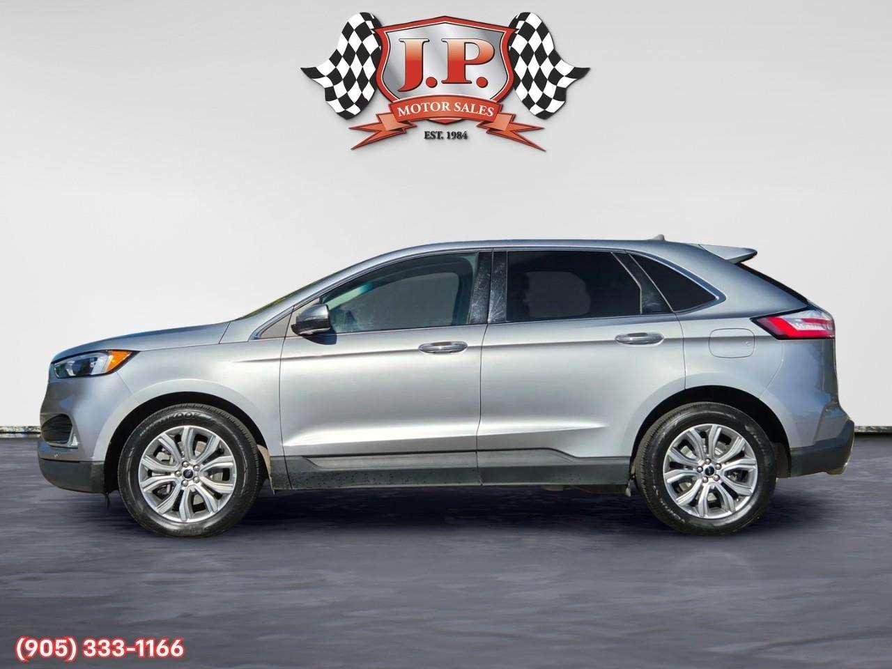 2023 Ford Edge Titanium Apple CarPlay & Android Auto • Built-In Wi-Fi Hotspot • Remote Start System • Heated Front Seats • Lane Assist • Photo