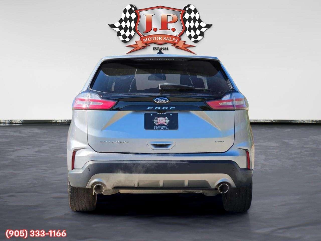 2023 Ford Edge Titanium Apple CarPlay & Android Auto • Built-In Wi-Fi Hotspot • Remote Start System • Heated Front Seats • Lane Assist • Photo