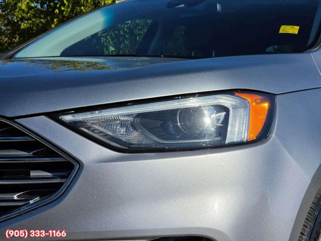 2023 Ford Edge Titanium Apple CarPlay & Android Auto • Built-In Wi-Fi Hotspot • Remote Start System • Heated Front Seats • Lane Assist • Photo