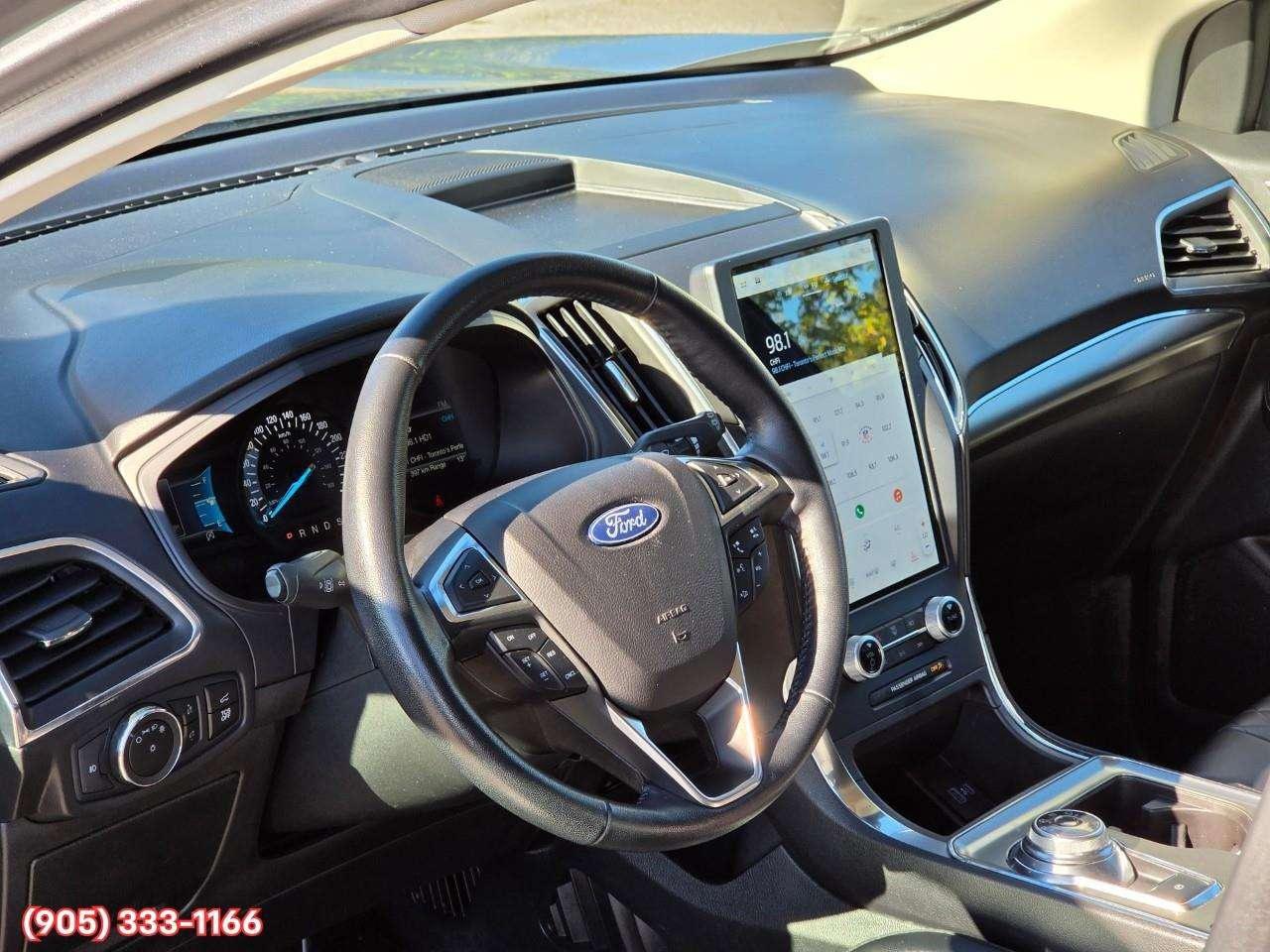 2023 Ford Edge Titanium Apple CarPlay & Android Auto • Built-In Wi-Fi Hotspot • Remote Start System • Heated Front Seats • Lane Assist • Photo