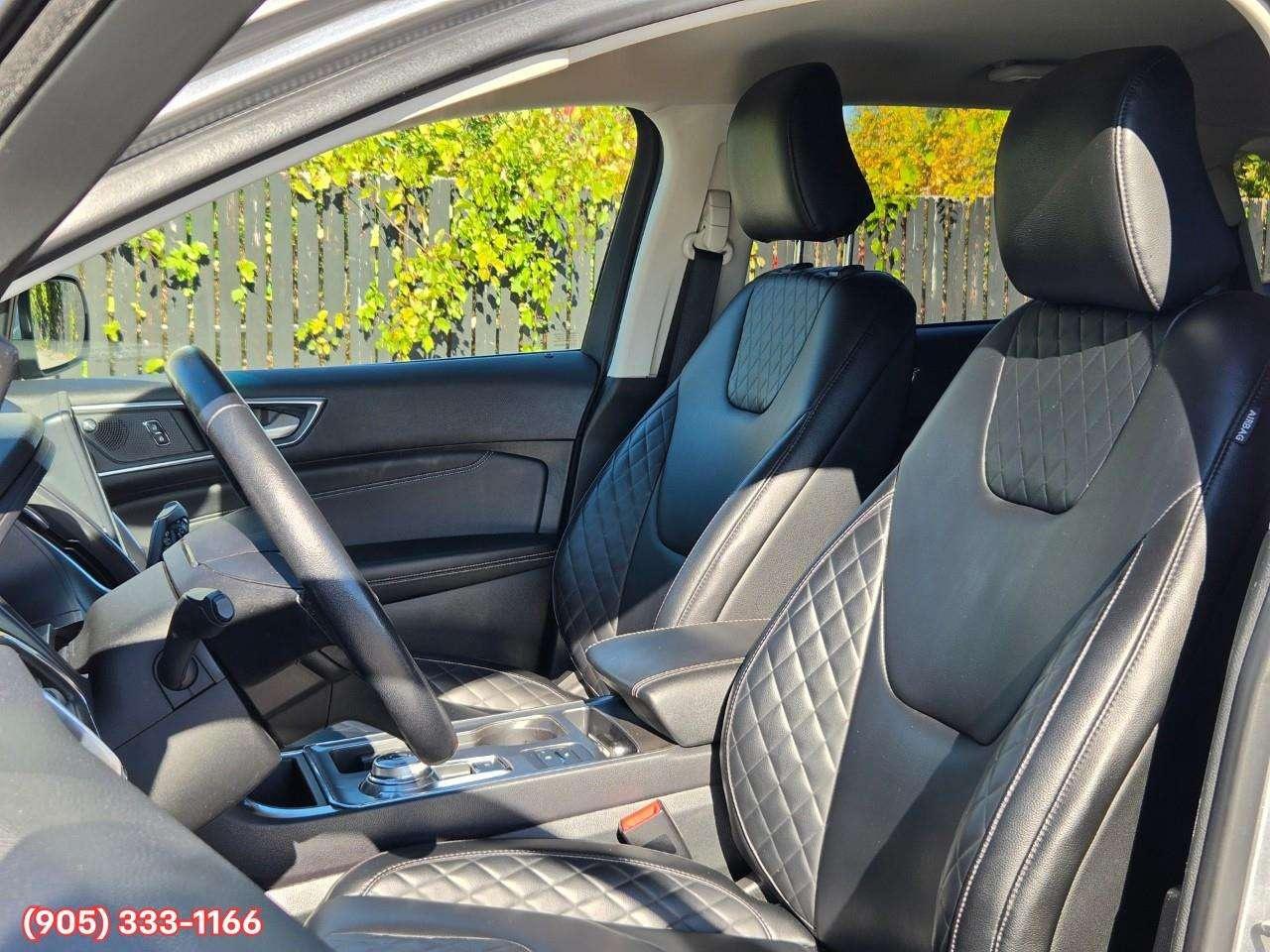 2023 Ford Edge Titanium Apple CarPlay & Android Auto • Built-In Wi-Fi Hotspot • Remote Start System • Heated Front Seats • Lane Assist • Photo