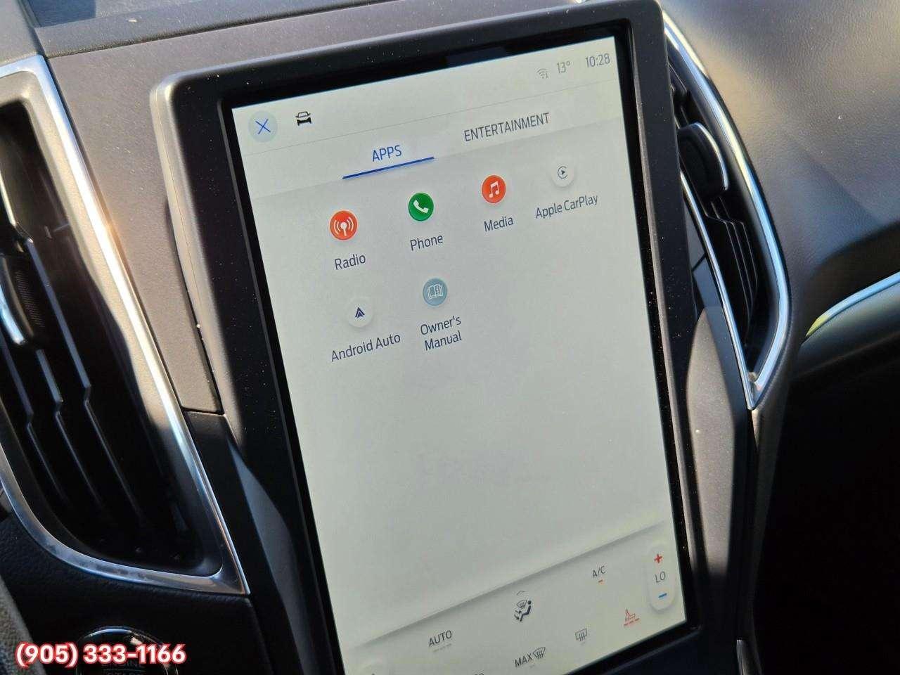 2023 Ford Edge Titanium Apple CarPlay & Android Auto • Built-In Wi-Fi Hotspot • Remote Start System • Heated Front Seats • Lane Assist • Photo