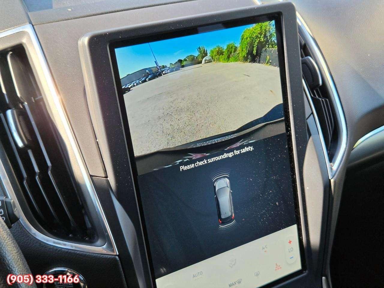 2023 Ford Edge Titanium Apple CarPlay & Android Auto • Built-In Wi-Fi Hotspot • Remote Start System • Heated Front Seats • Lane Assist • Photo