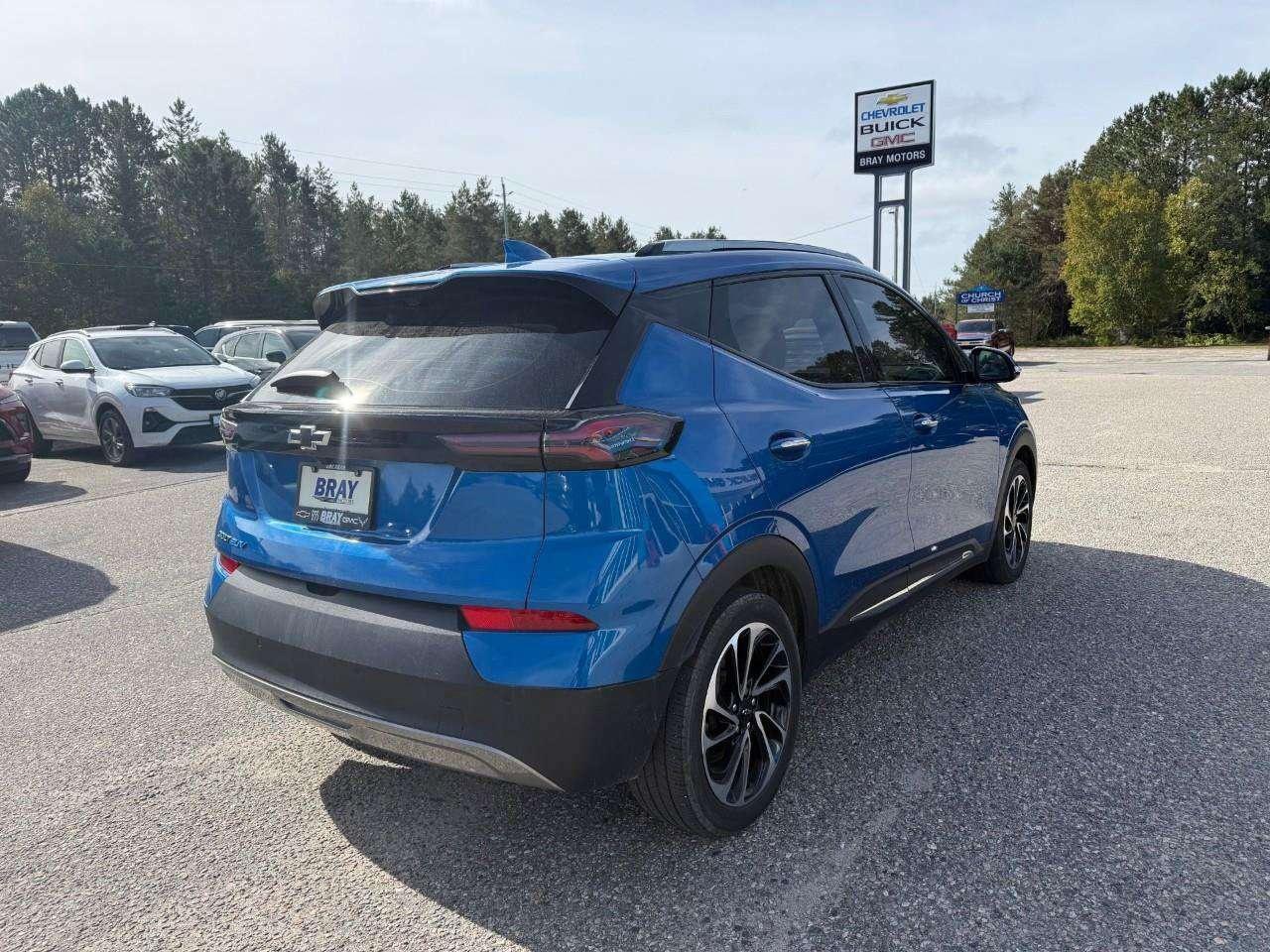2023 Chevrolet Bolt REAR CARGO STORAGE, DOUBLE FLOOR. WIRELESS CHARGING. REAR PARK ASSIST. HEATED SEATS & STEERING WHEEL. DC FAST CHARGING. Photo